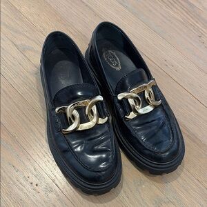 Tod's Elegant Black Loafers with Gold Accent